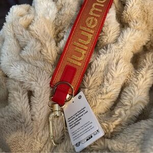 lululemon athletica Red and Gold Branded Wristlet Keychain